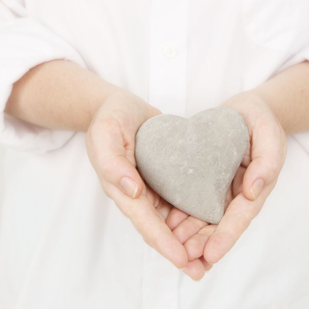 hands holding a heart