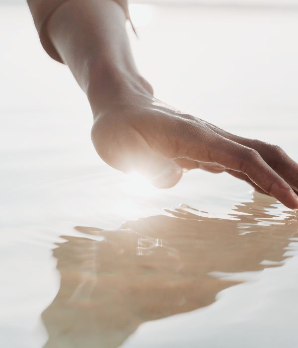 Untitled design-5 hand touching water with light