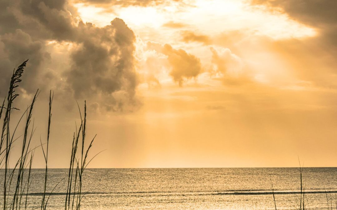 Sun through clouds over ocean