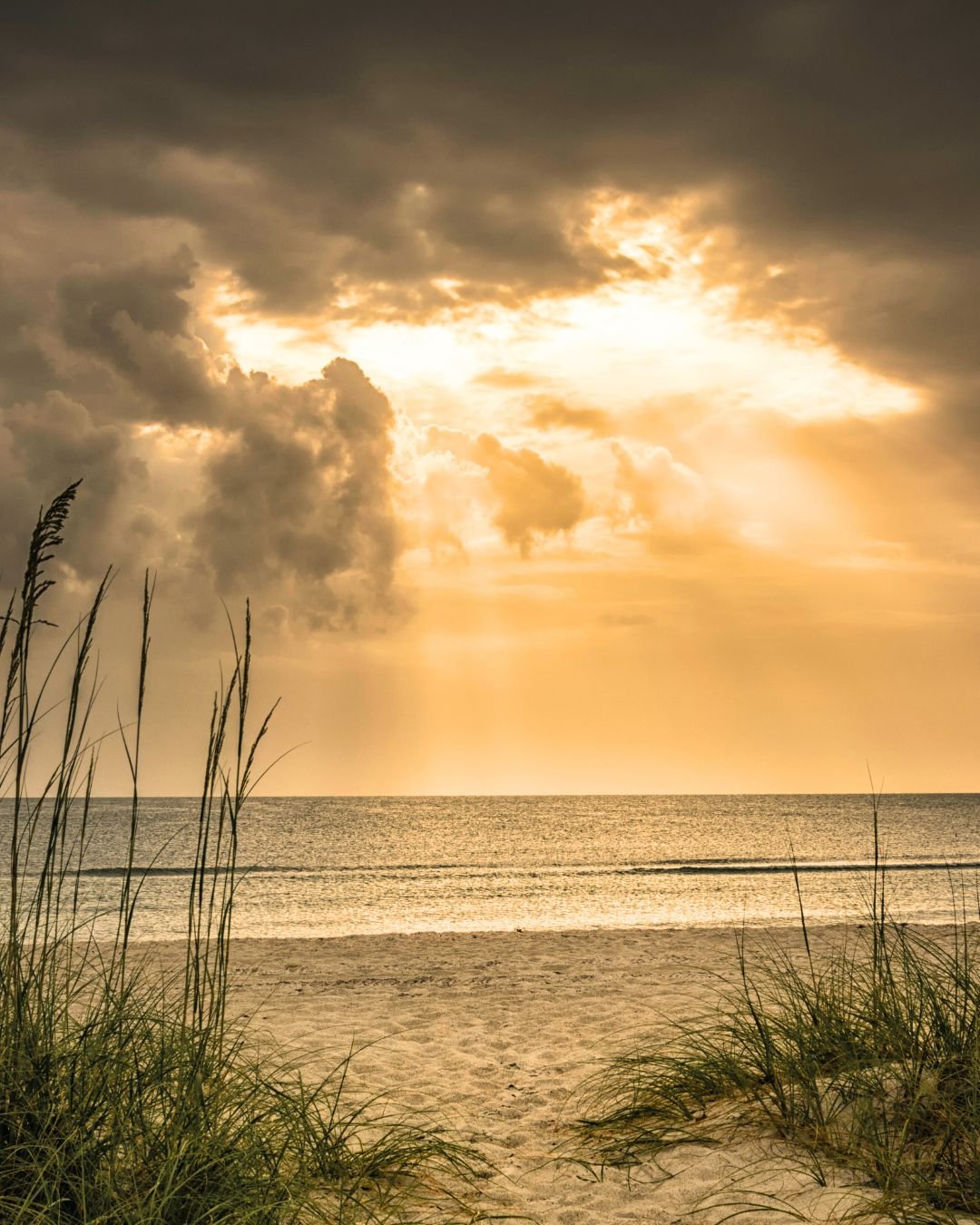 Sun through clouds over ocean