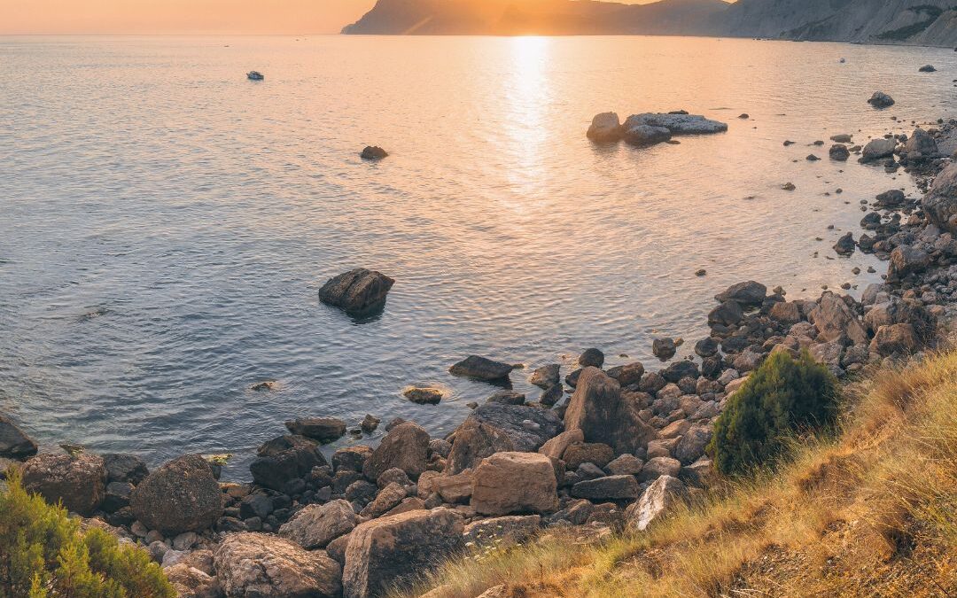 sunset over ocean bay