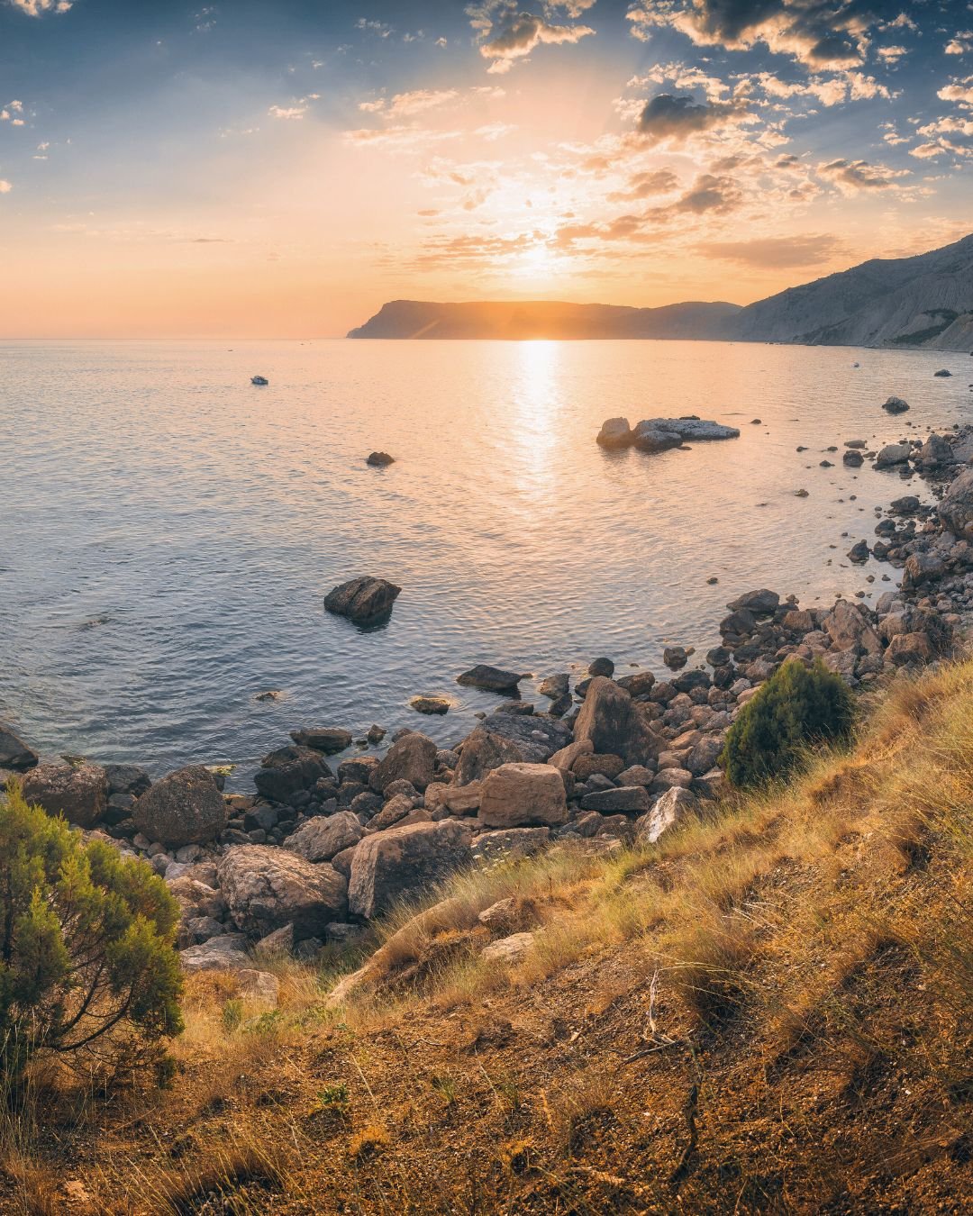 sunset over ocean bay