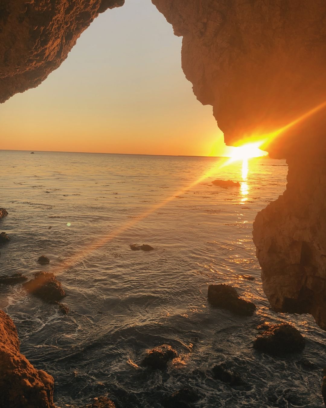 sunset through cave