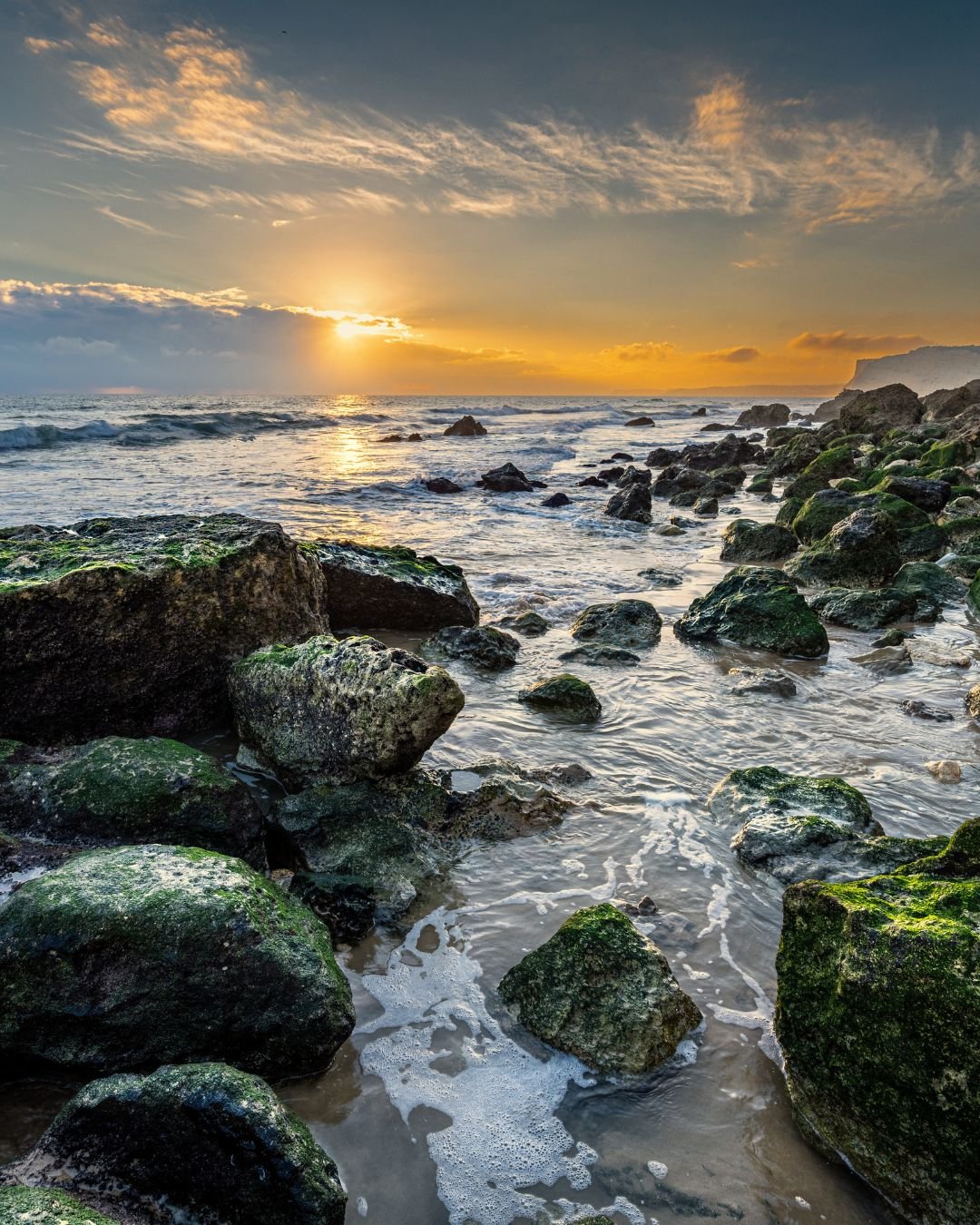 sunrise and ocean rocks