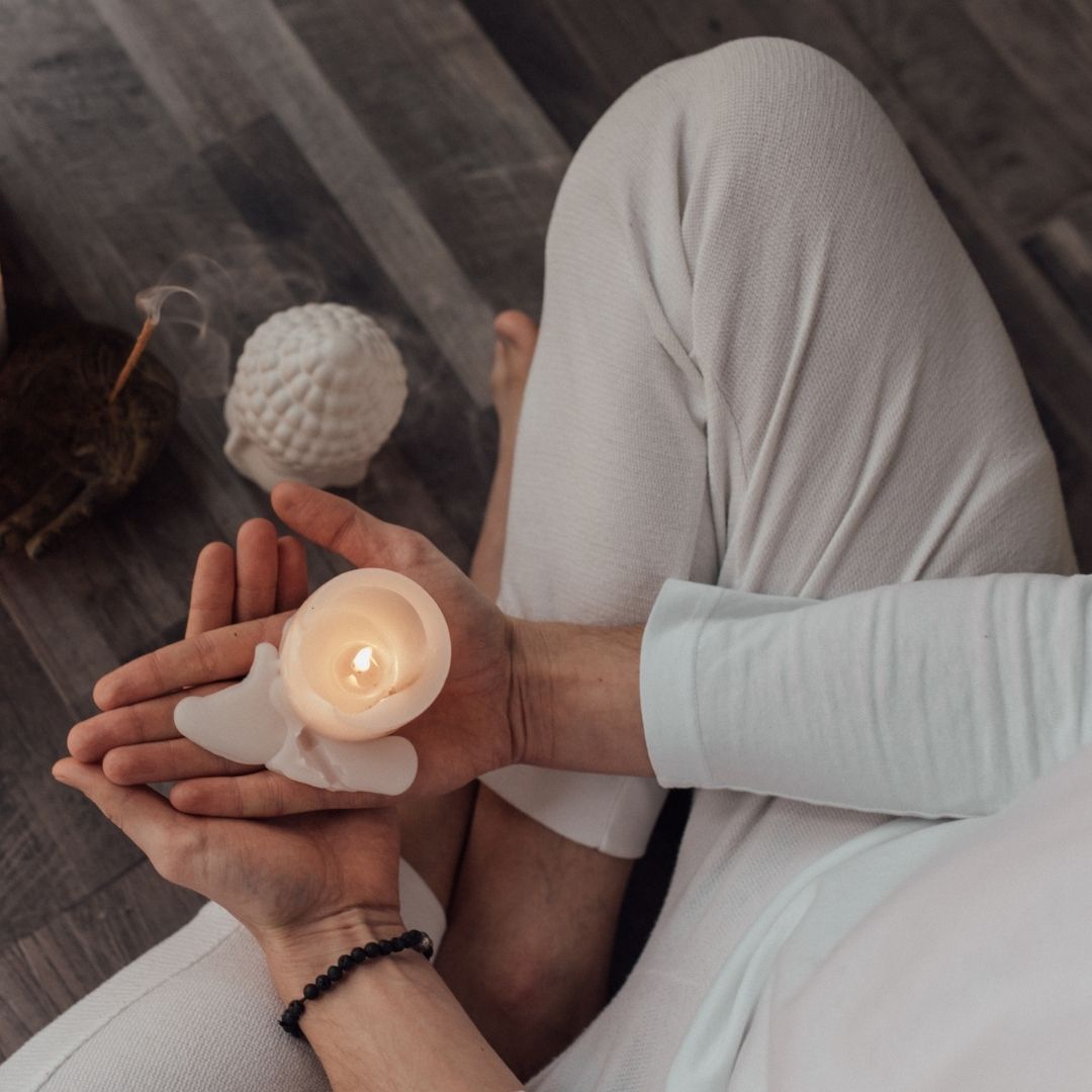 ptm spiritual holding a candle