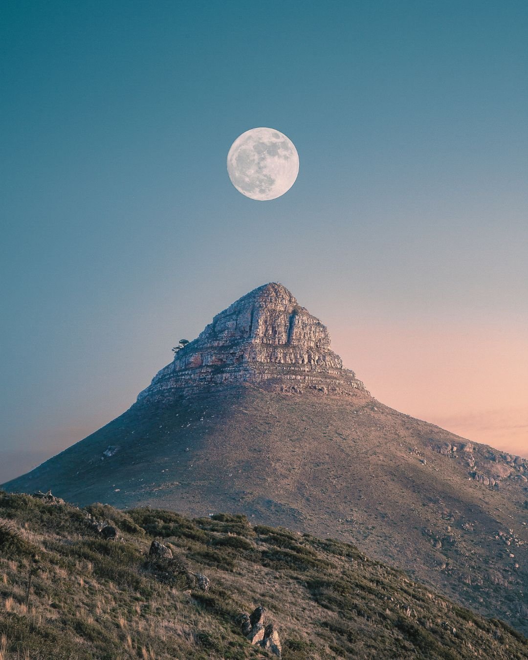 full moon mountain peak