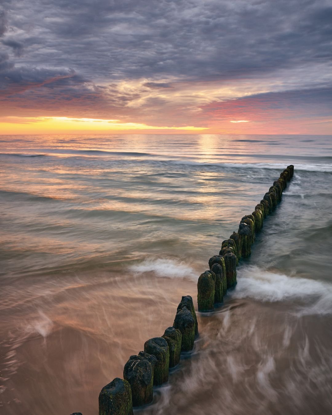 sunrise ocean with stone path