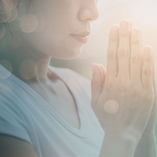 woman with prayer hands