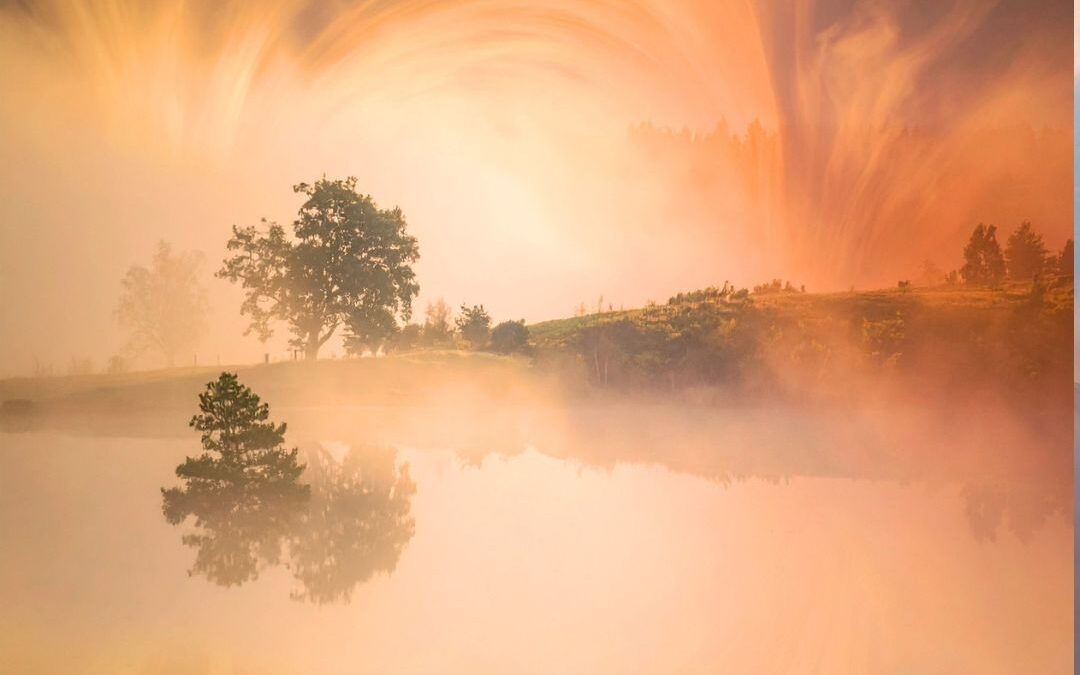 sunset over water and mist