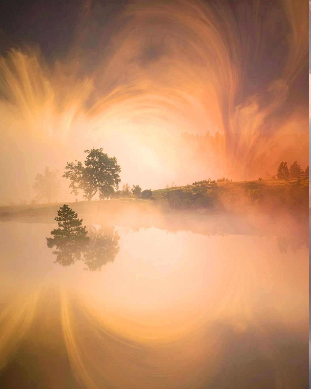 sunset over water and mist