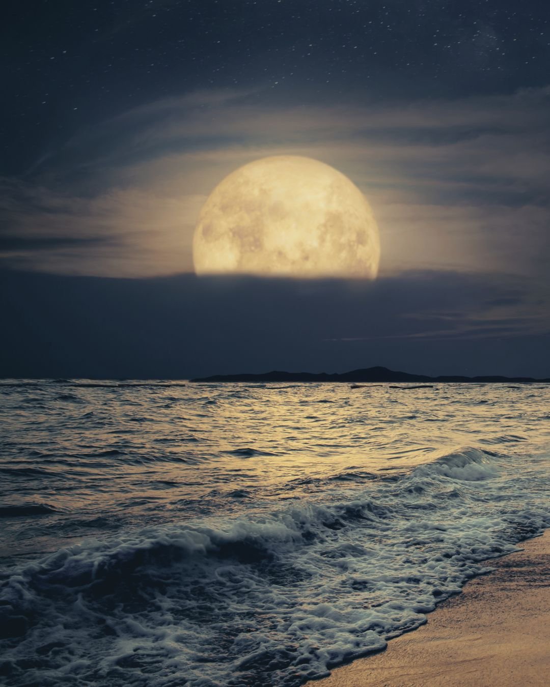 full moon rising over ocean