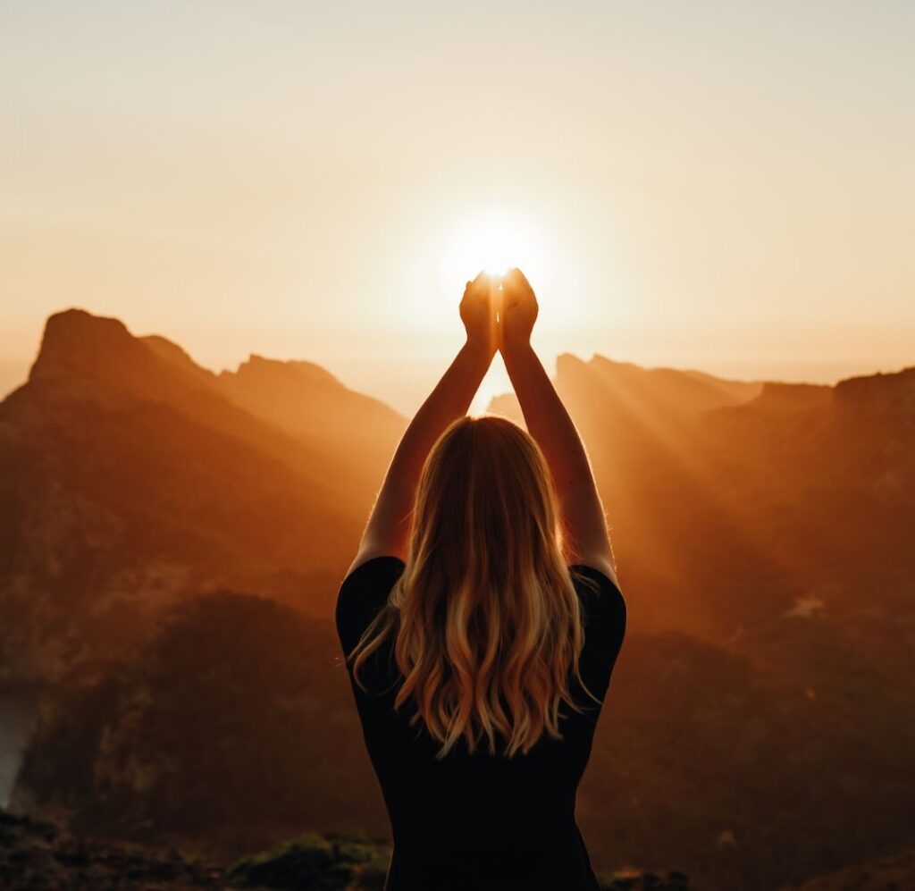 woman holding the sun