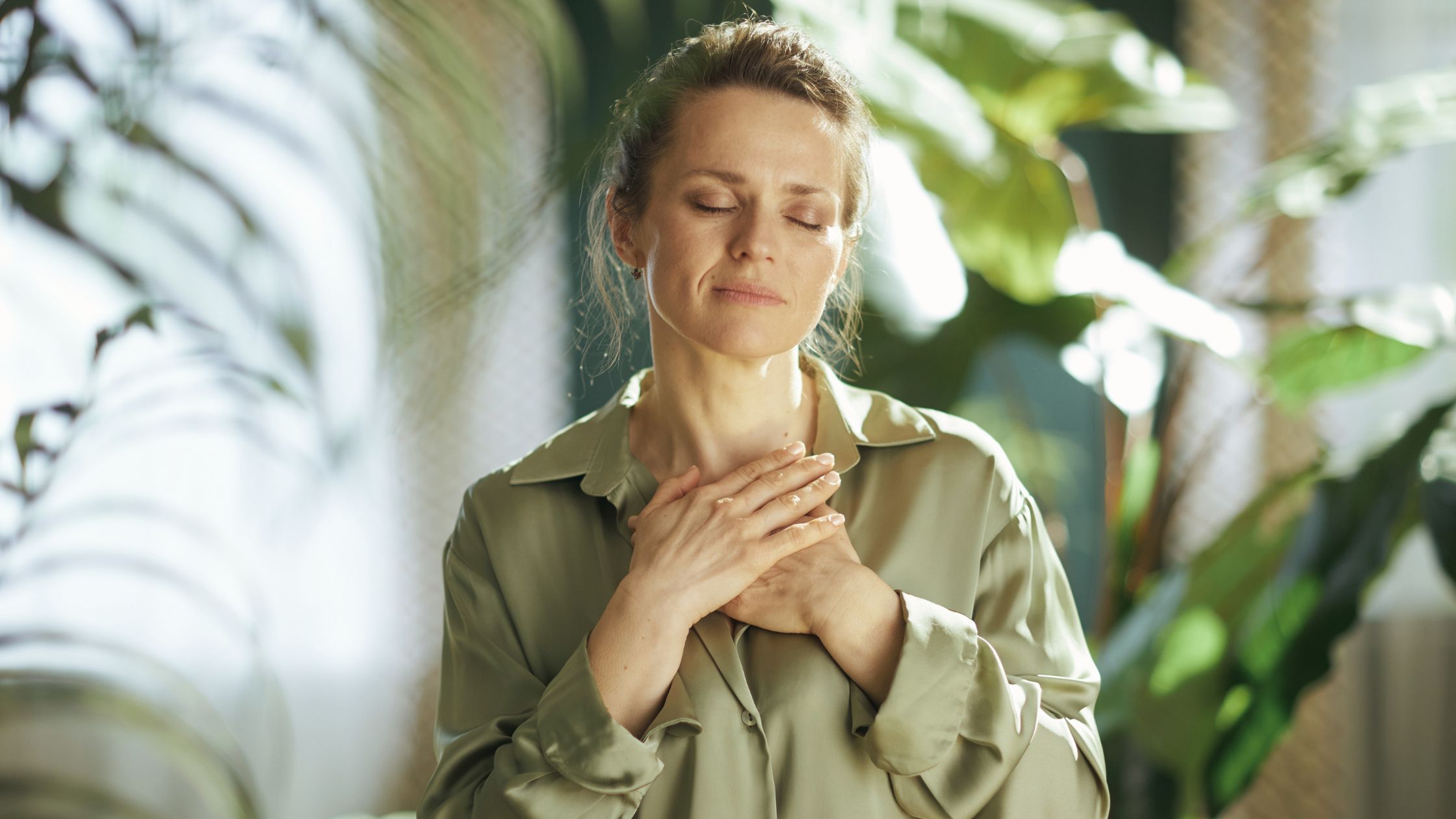 woman with hands on heart