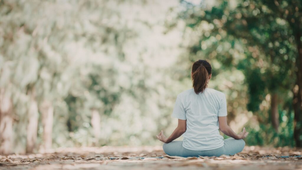 woman sitting in path