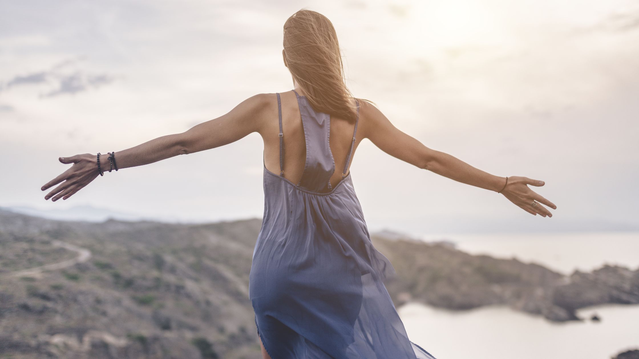woman with arms open