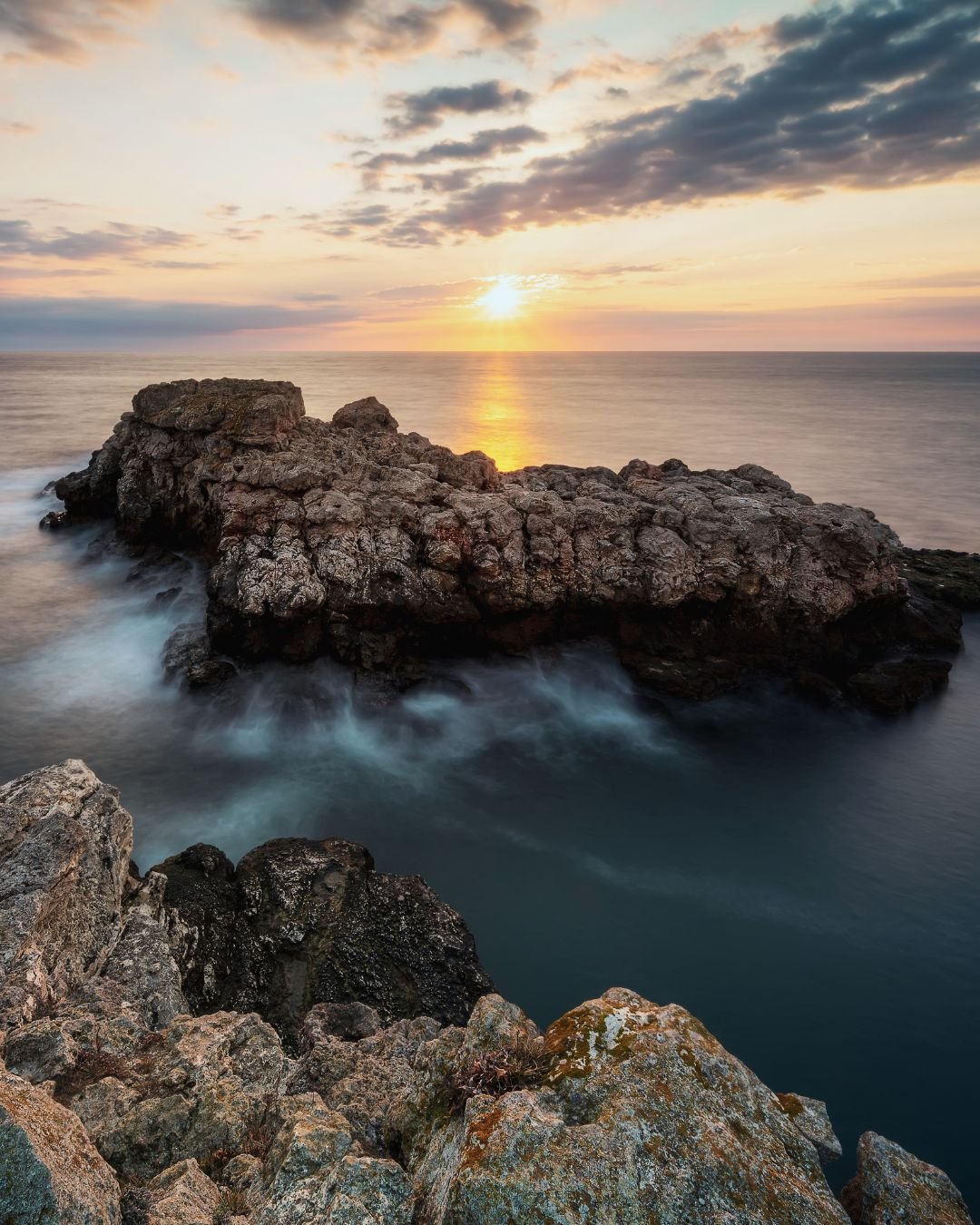 sunrise over ocean and rocks