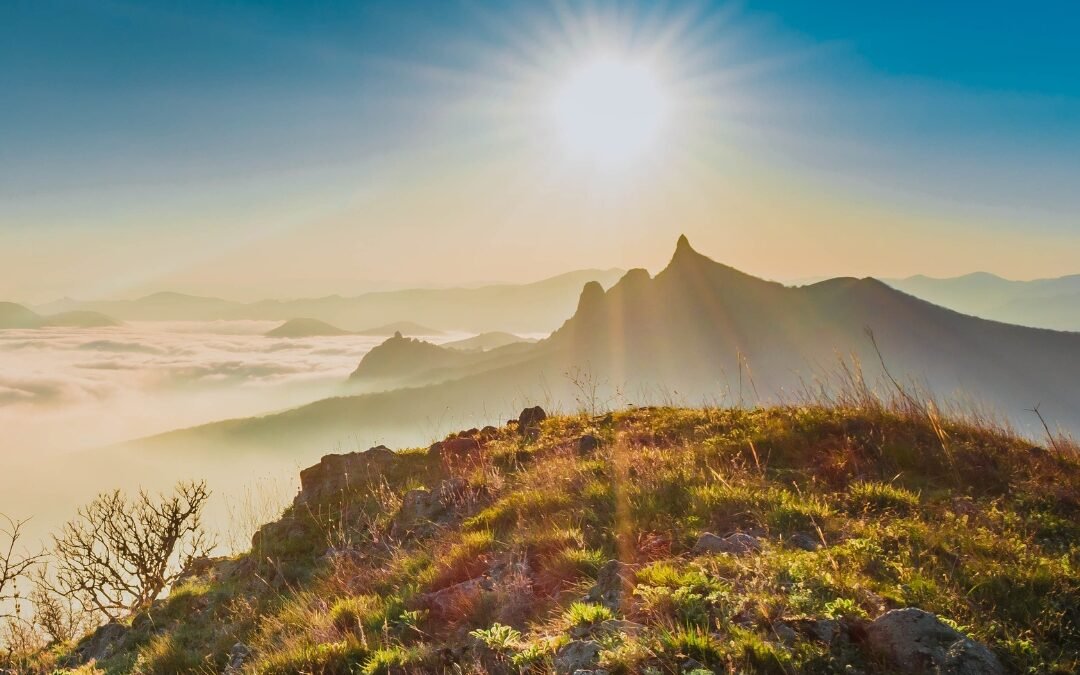 sun over mountain peak