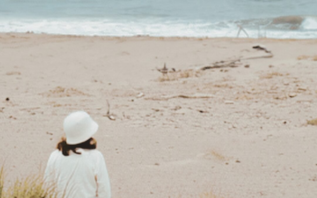 woman sitting on the beach